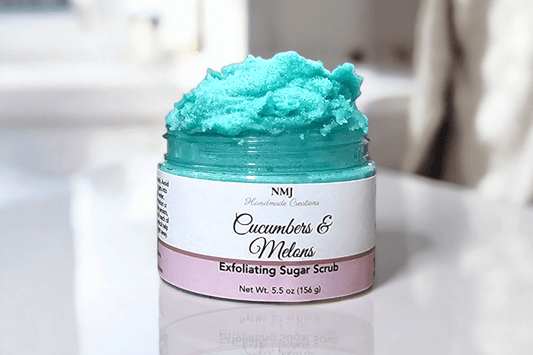 Exfoliating Sugar Scrub with Cucumbers & Melons, 5.5 oz jar, showcasing vibrant blue scrub texture, by NMJ, for radiant skin care.