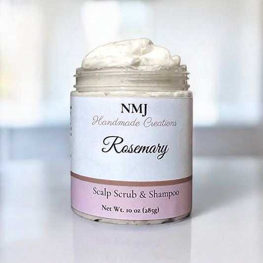 A jar of NMJ Handmade Creations' Rosemary Scalp Scrub & Shampoo, filled with a rich, creamy substance, showcased against a minimalist, modern bathroom background