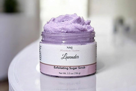 Lavender Exfoliating Sugar Scrub by NMJ, 5.5 oz jar, featuring a calming scent for smooth, hydrated skin.