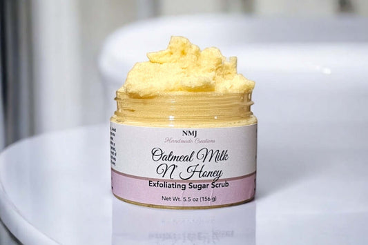 Exfoliating Sugar Scrub 5.5 oz, Oatmeal Milk N' Honey scent by NMJ, in a jar for smooth, hydrated skin.